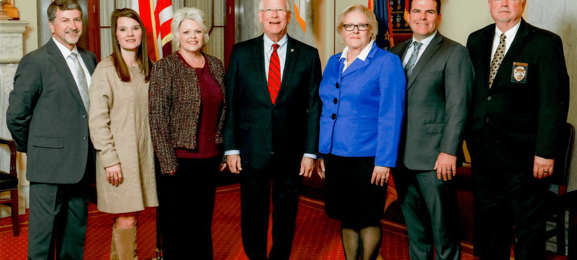 Photo of members with Sen. Roger Wicke